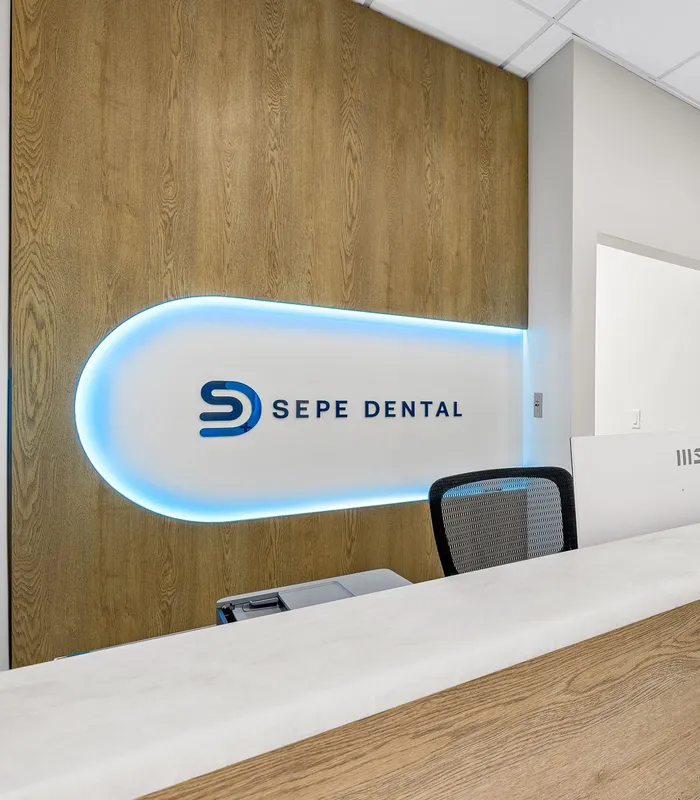 Sepe Dental front desk and backlit logo signage
