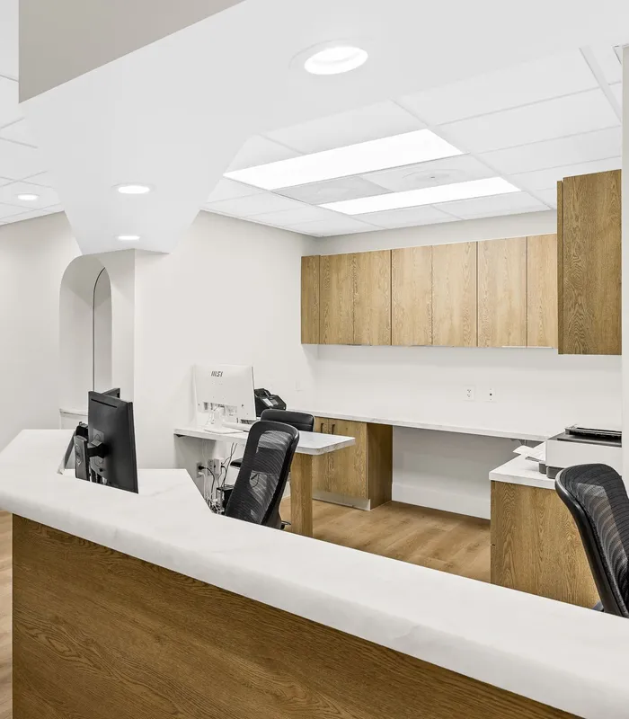 Front office workstations behind the check-in counter at Sepe Dental